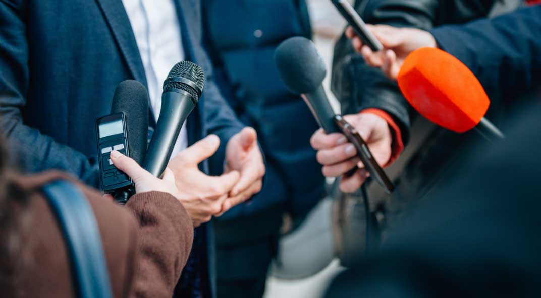 Closeups of microphones at a press conference